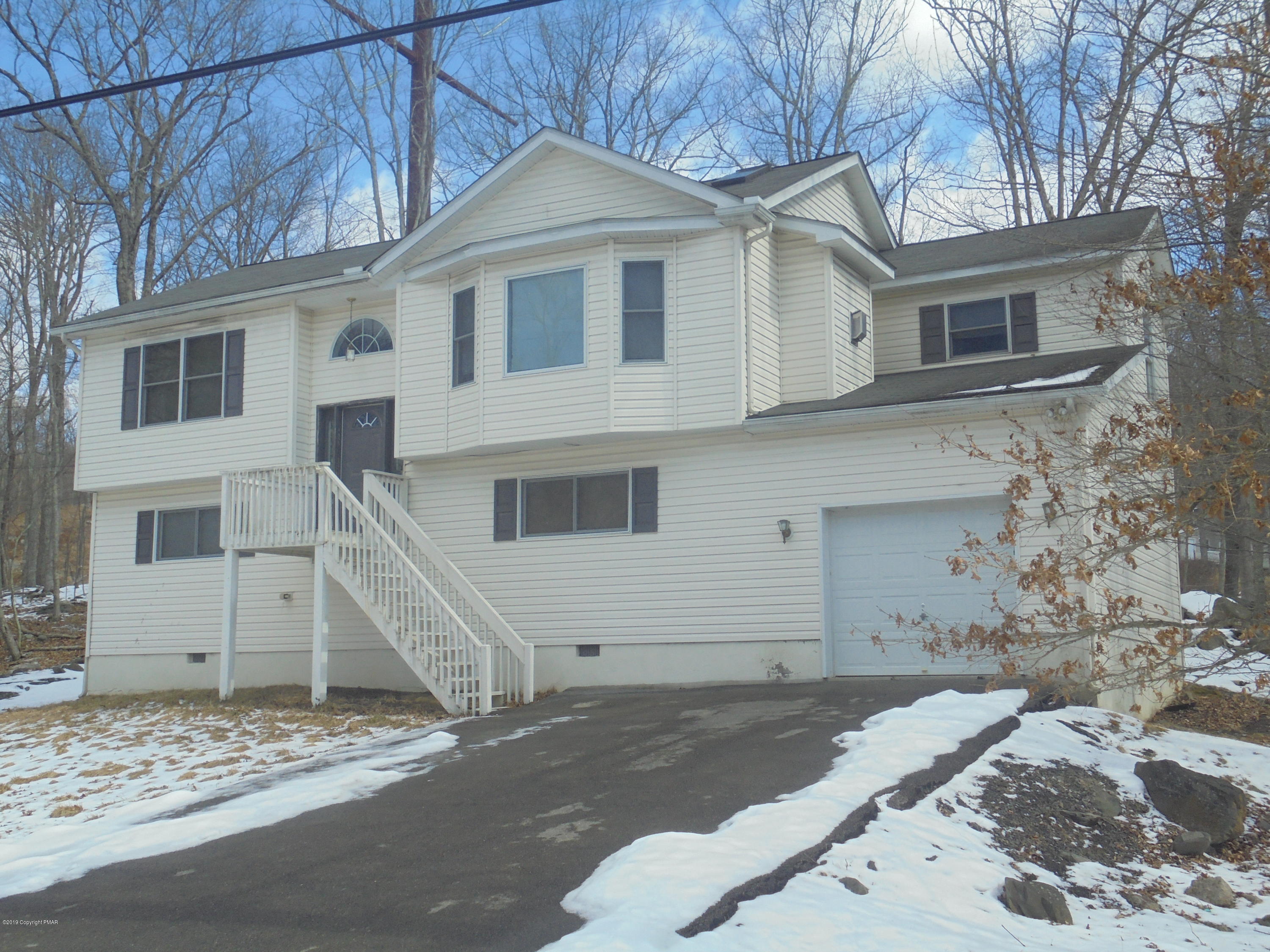 388 Canterbury Road Bushkill, PA 18324 - Photo 3 of 7 a front view of a house with a yard