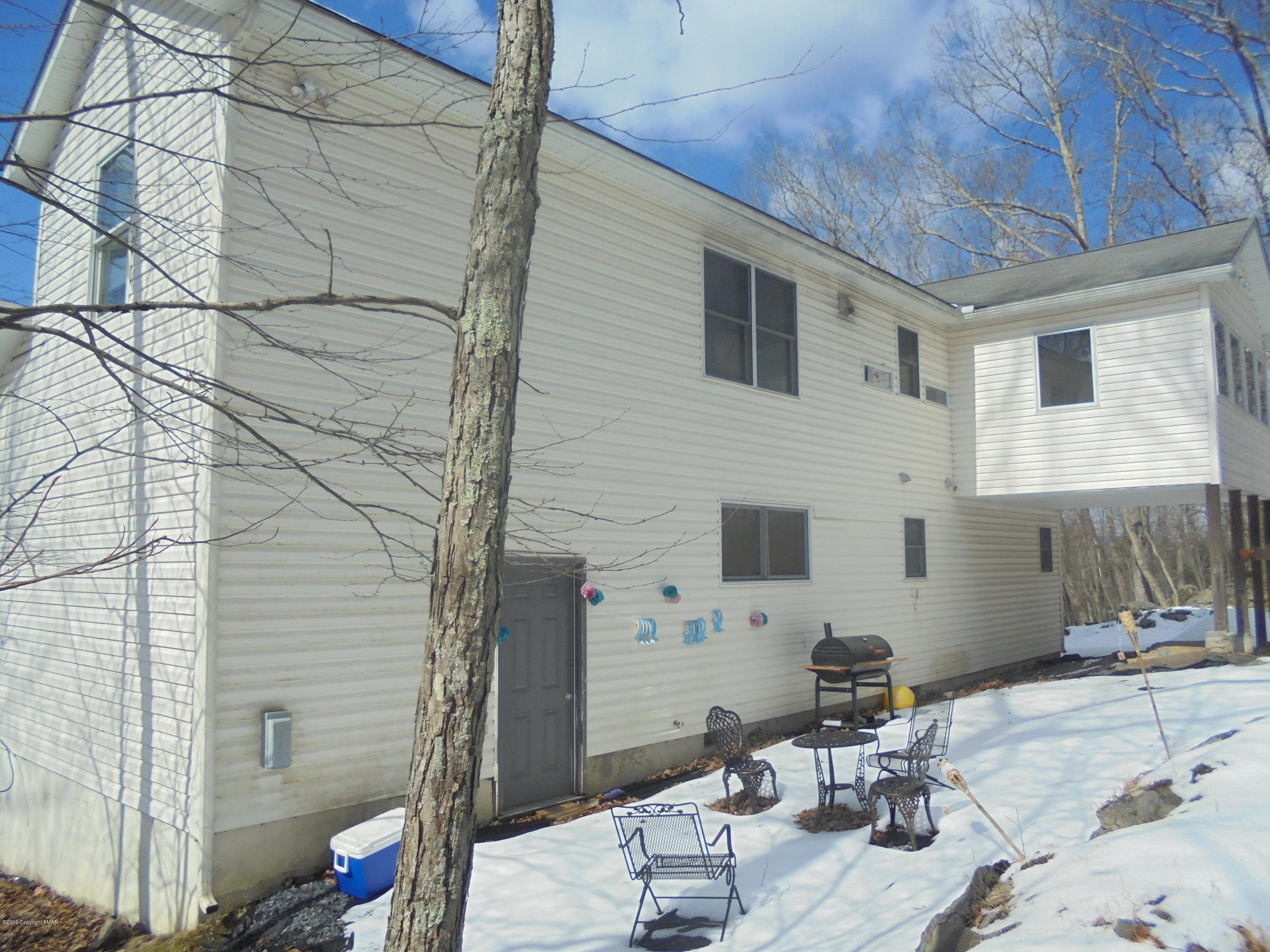 388 Canterbury Road Bushkill, PA 18324 - Photo 4 of 7 a backyard of a house with outdoor seating
