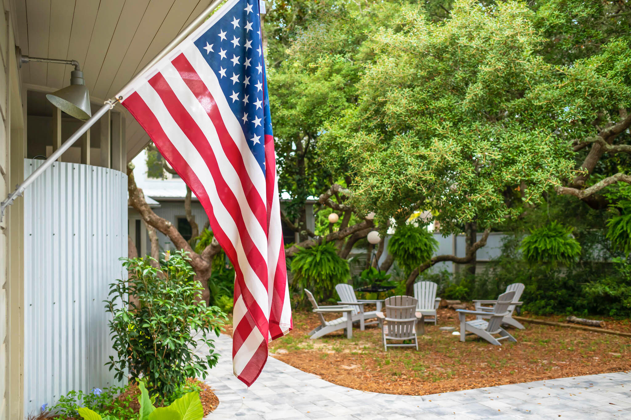 450 Defuniak Street Santa Rosa Beach, FL 32459 - Photo 14 of 75 a view of a backyard with a table and chairs