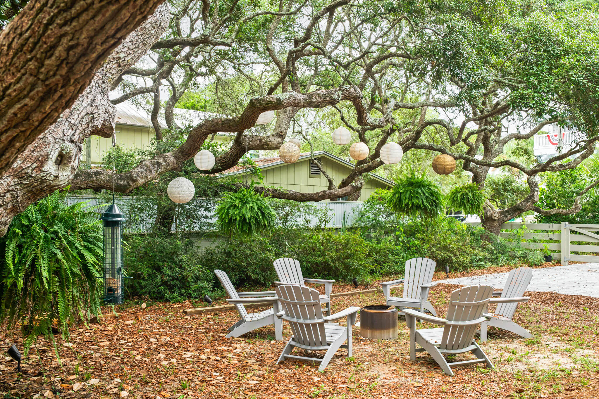 450 Defuniak Street Santa Rosa Beach, FL 32459 - Photo 17 of 75 a view of a chairs and table in a backyard