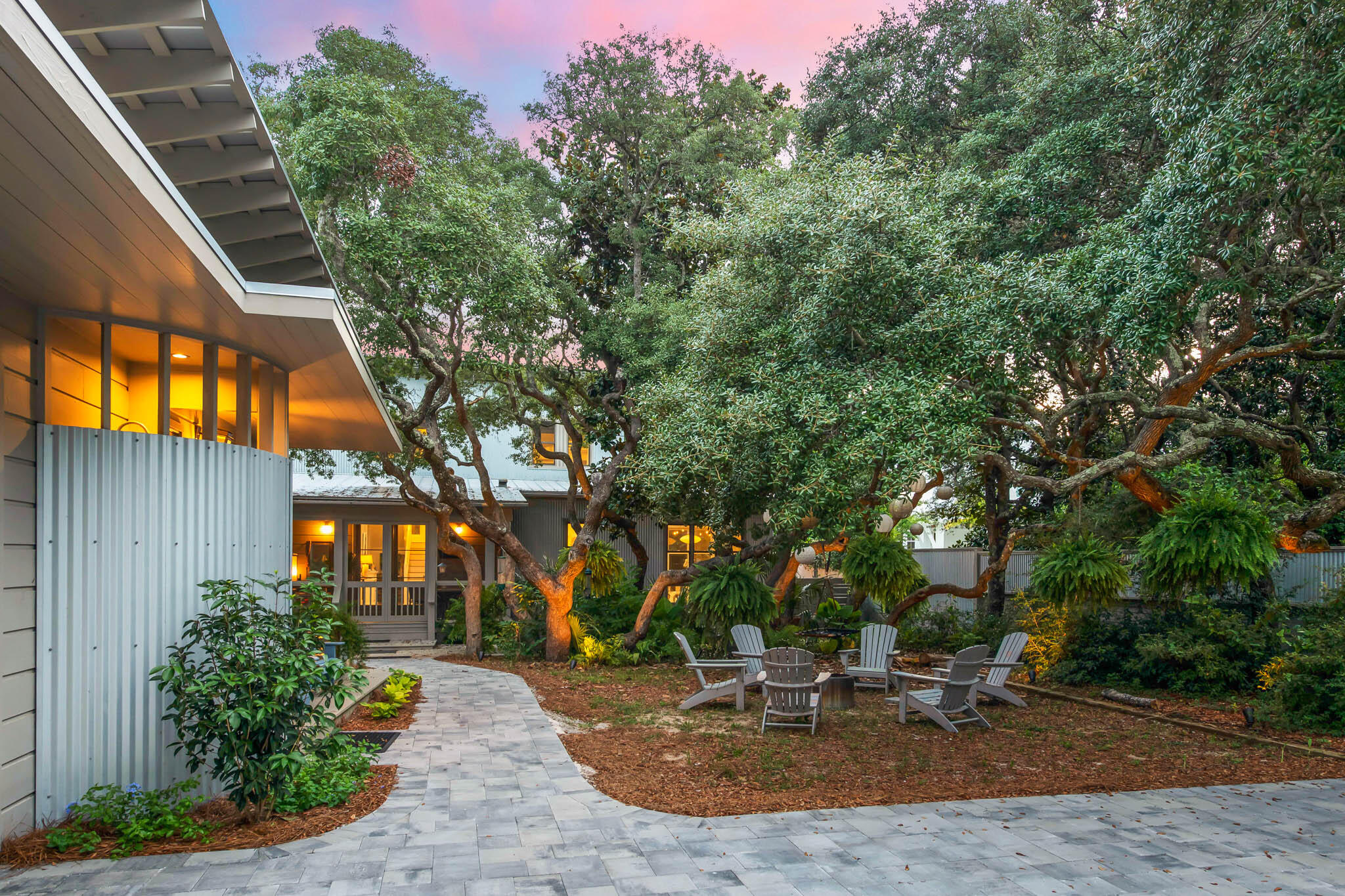450 Defuniak Street Santa Rosa Beach, FL 32459 - Photo 2 of 75 a backyard of a house with outdoor seating