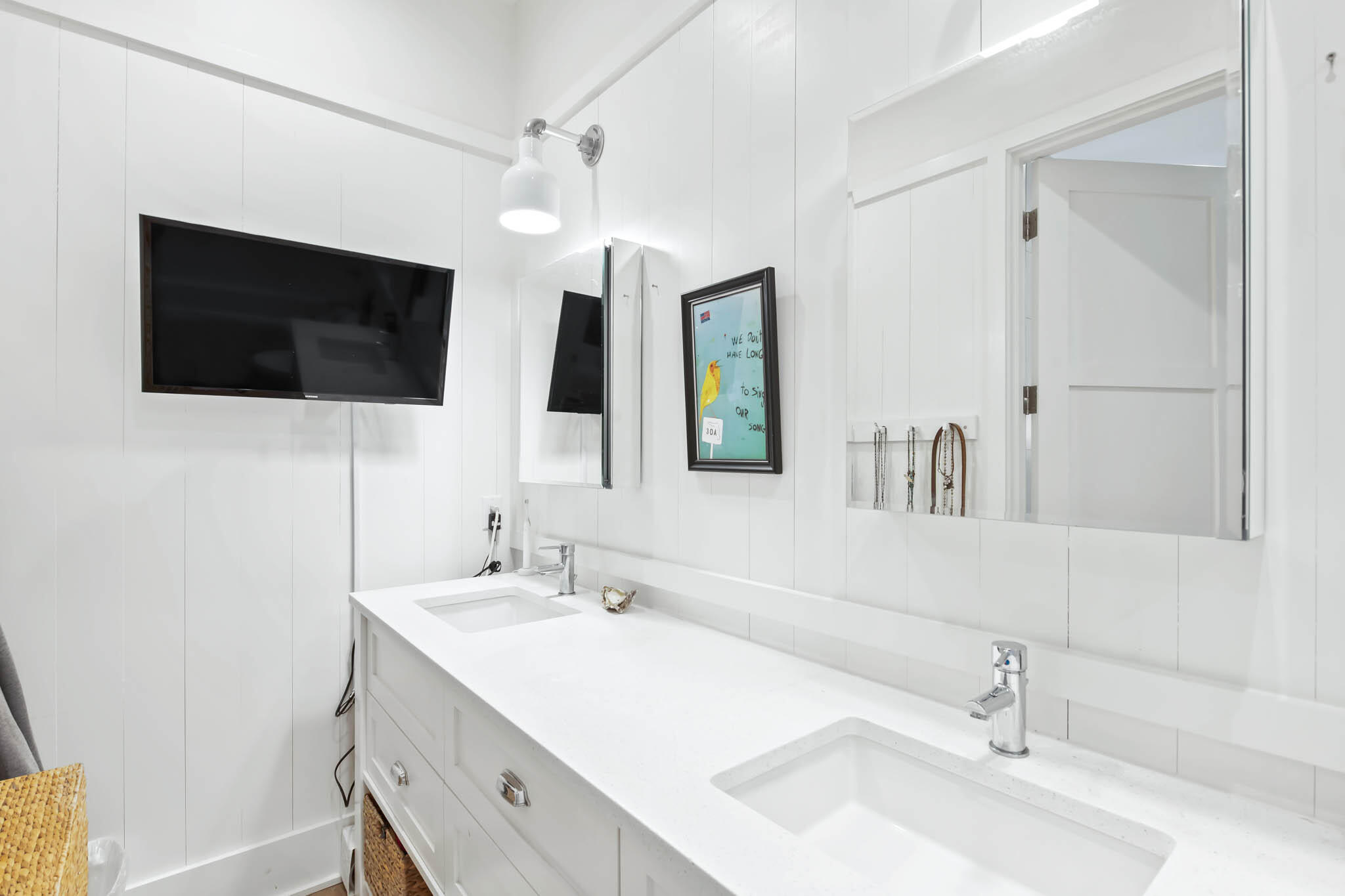 450 Defuniak Street Santa Rosa Beach, FL 32459 - Photo 47 of 75 a bathroom with a double vanity sink a mirror and shower