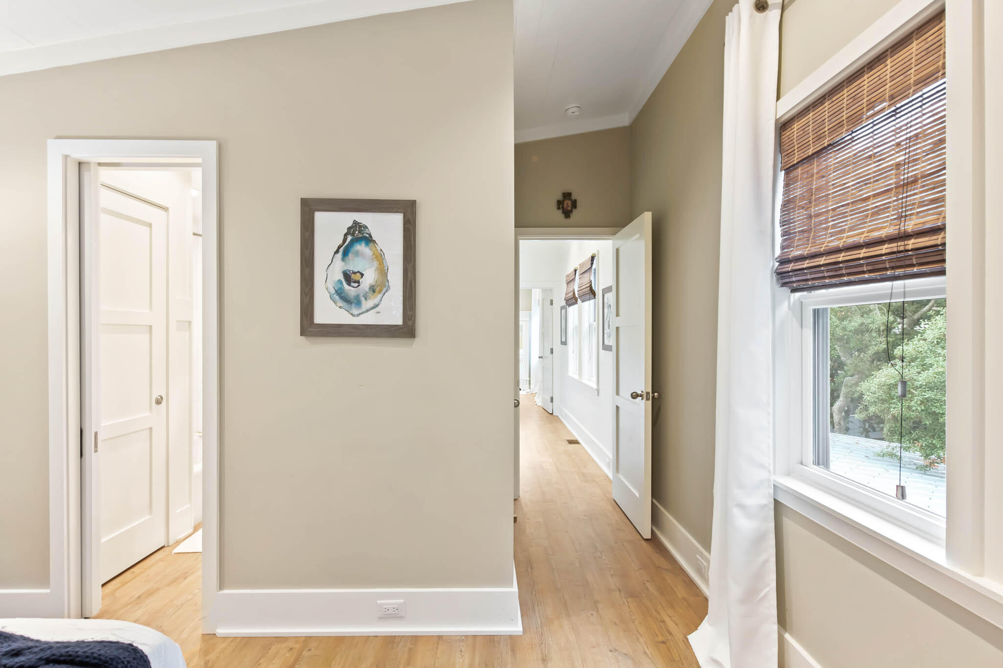 450 Defuniak Street Santa Rosa Beach, FL 32459 - Photo 51 of 75 a view of a hallway with wooden floor and doors