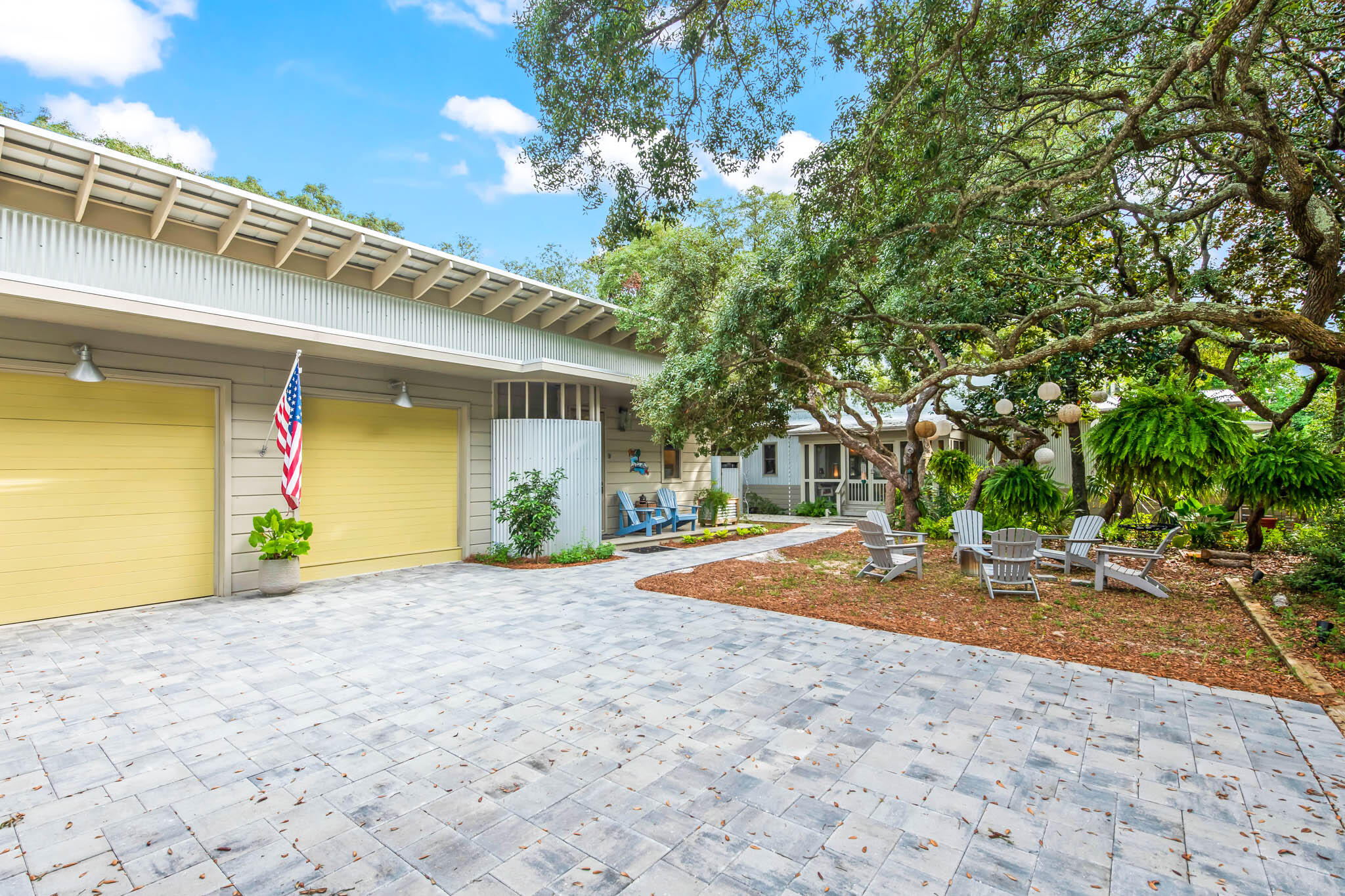 450 Defuniak Street Santa Rosa Beach, FL 32459 - Photo 69 of 75 a view of a house with a patio and a yard
