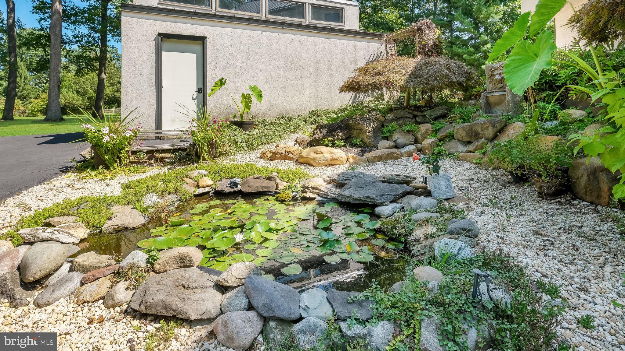 261 Clemens Road Harleysville, PA 19438 - Photo 31 of 37 Koi pond near front entry