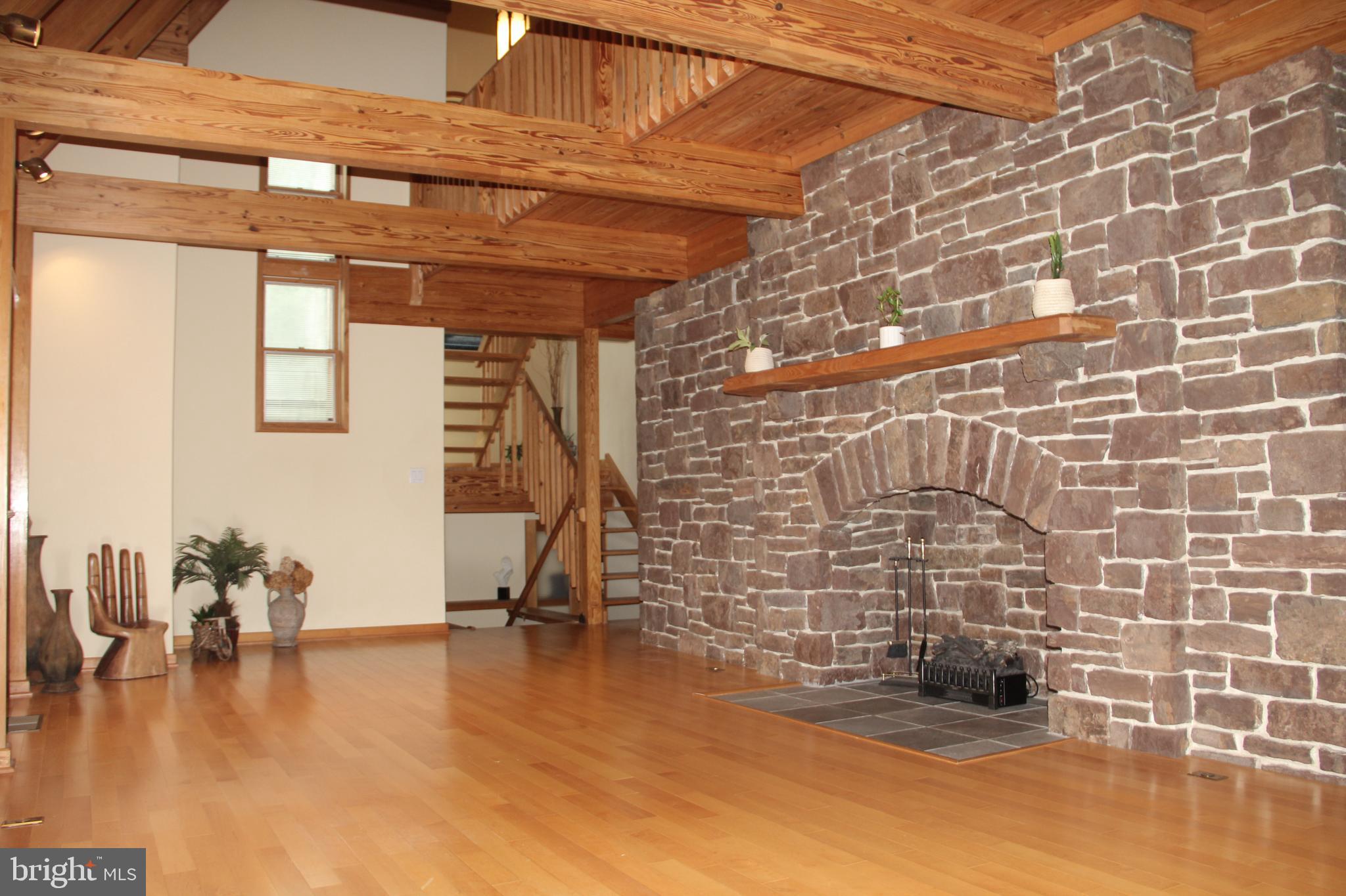 261 Clemens Road Harleysville, PA 19438 - Photo 6 of 37 Stone fireplace, knotty pine beams & floors