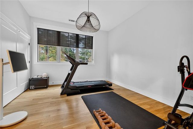 a swimming pool view with a outdoor seating