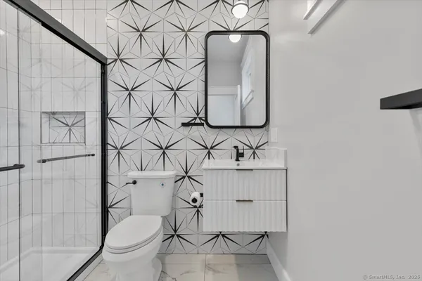 a bathroom with a toilet and a sink