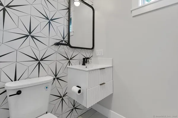a bathroom with a sink and mirror