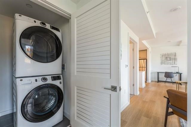 401 Jackson Street, Unit 503 Hoboken, NJ 07030 - Photo 15 of 29 a view of a hallway with washer and dryer