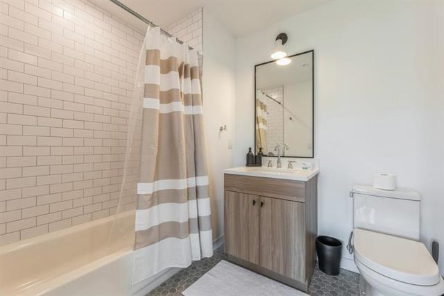 401 Jackson Street, Unit 503 Hoboken, NJ 07030 - Photo 17 of 29 a bathroom with a sink a toilet and shower