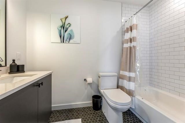 401 Jackson Street, Unit 503 Hoboken, NJ 07030 - Photo 24 of 29 a bathroom with a toilet a sink and bathtub