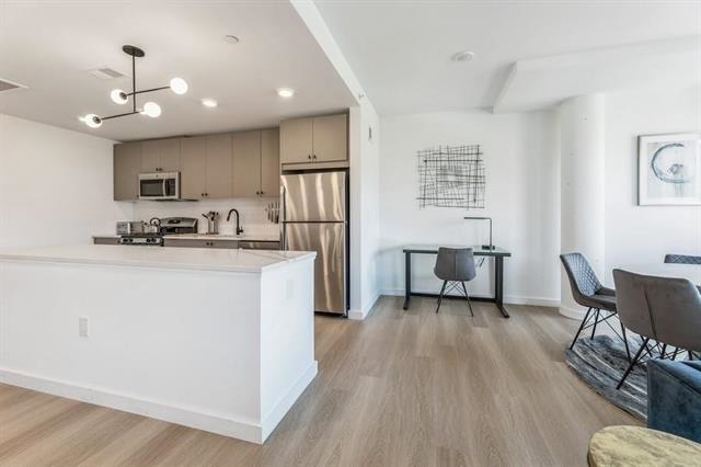 401 Jackson Street, Unit 503 Hoboken, NJ 07030 - Photo 4 of 29 a living room with furniture and a wooden floor