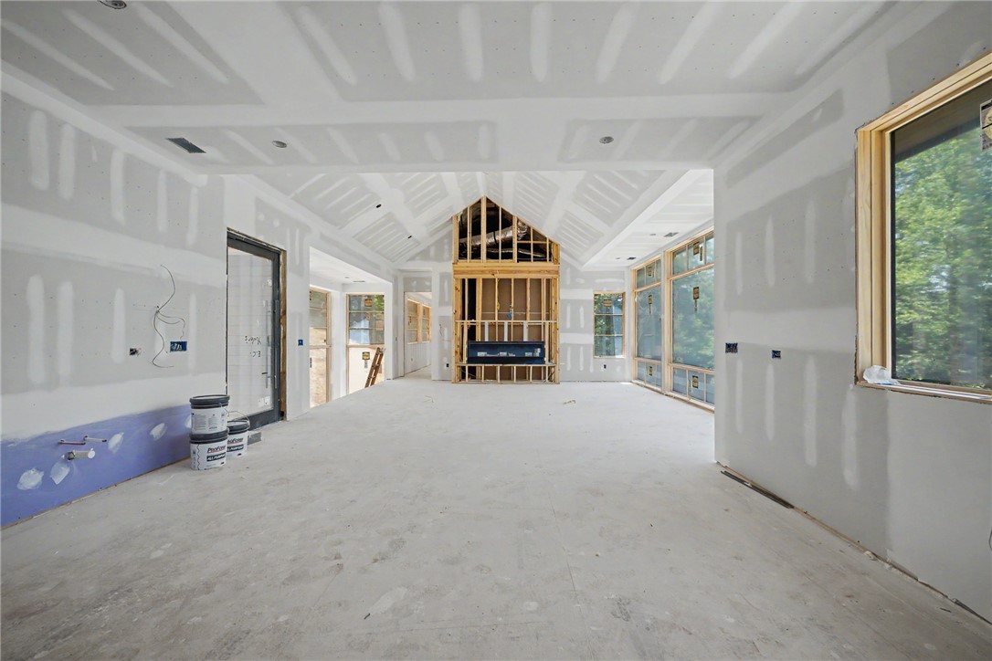 166 Ellenburg Creek Road Sunset, SC 29685 - Photo 20 of 20 A grand open floor plan with vaulted ceilings, a framed fireplace, and generous window placements awaits your personal touch.