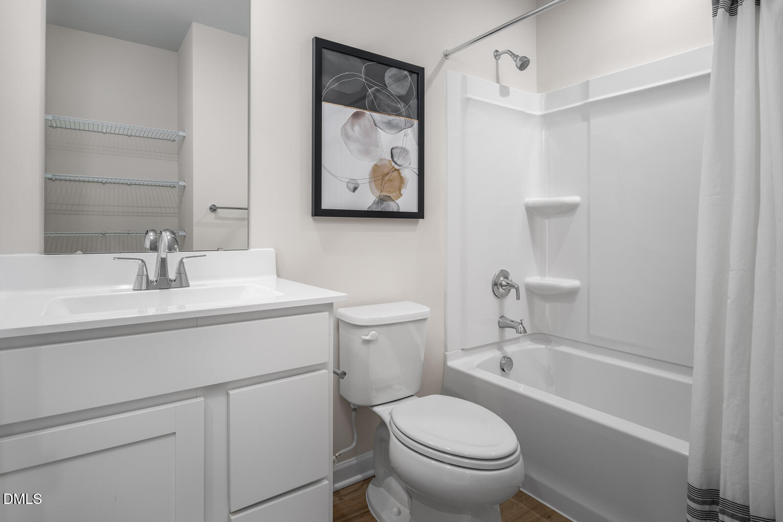 569 Wheatland Country Road Raleigh, NC 27603 - Photo 19 of 23 a bathroom with a toilet sink and mirror