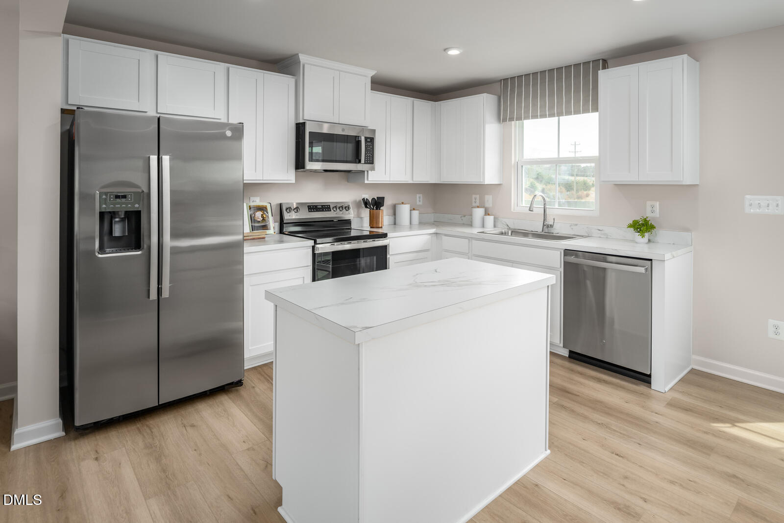 569 Wheatland Country Road Raleigh, NC 27603 - Photo 6 of 23 a kitchen with a refrigerator sink and microwave