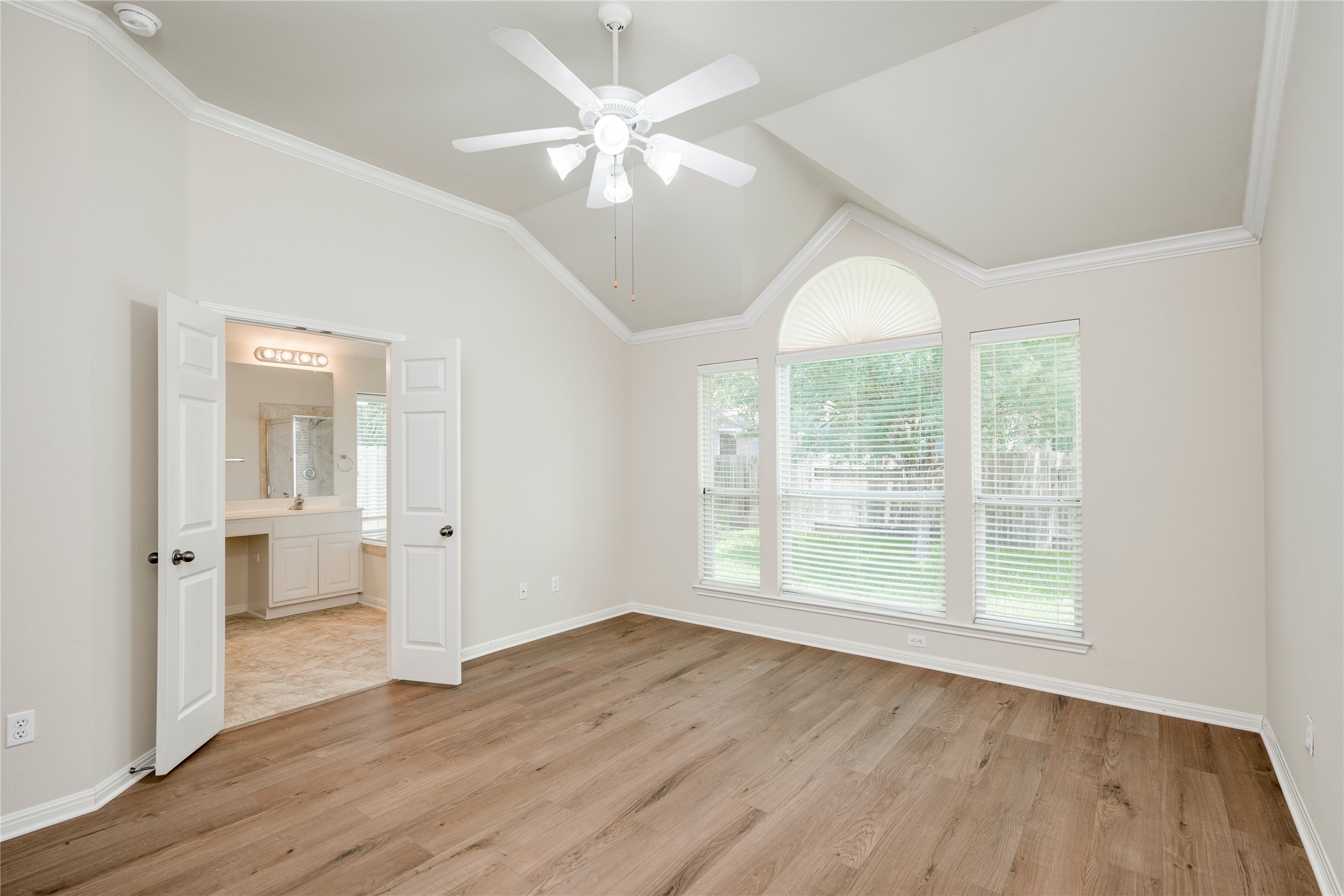 1813 Nelson Ranch Loop Cedar Park, TX 78613 - Photo 18 of 39 A vaulted ceiling crowns this generously proportioned room, featuring rich wood flooring and direct access to a private bathroom.