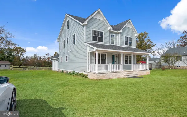 a big house with a big yard and large trees