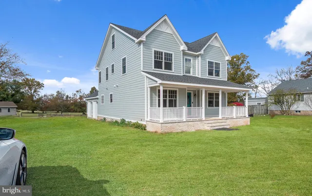 a big house with a big yard and large trees
