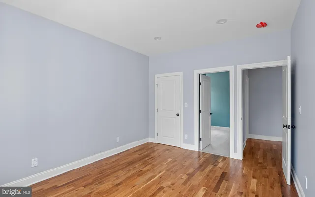 a view of room with wooden floor