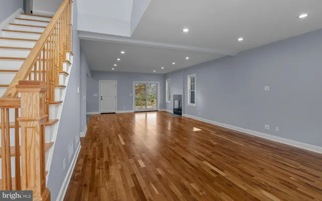 a view of room with window and wooden floor