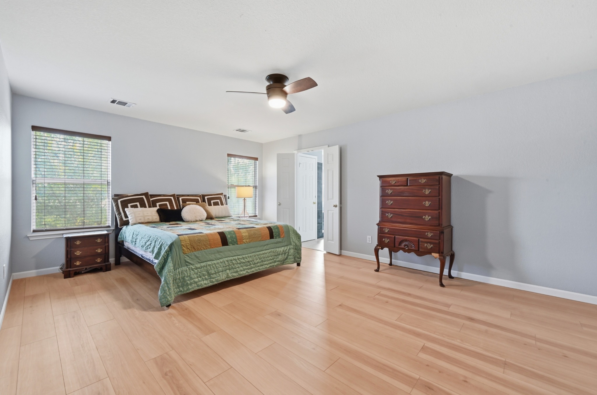 2700 Cradlerock Terrace Austin, TX 78748 - Photo 18 of 29 a bedroom with a bed and wooden floor