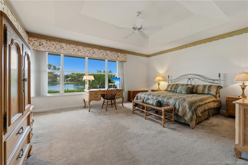 3510 Southeast Cambridge Drive Stuart, FL 34997 - Photo 15 of 38 Primary bedroom with lake views