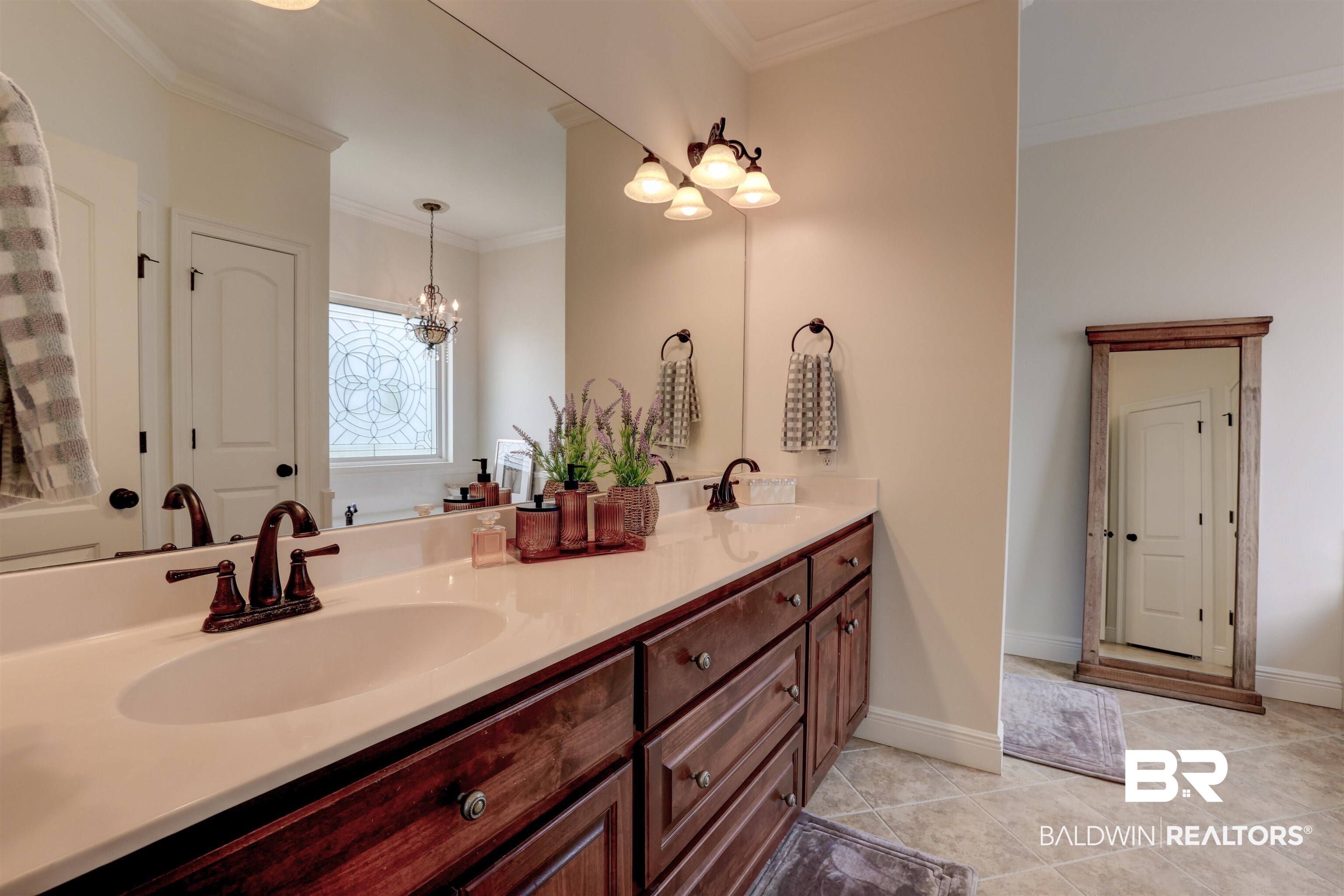 5565 Dawes Lane Theodore, AL 36582 - Photo 17 of 38 Bathroom with ornamental molding, vanity, a chandelier, and tile patterned floors