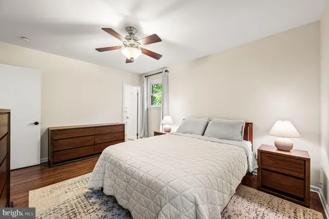 a bed room with a bed and a chandelier
