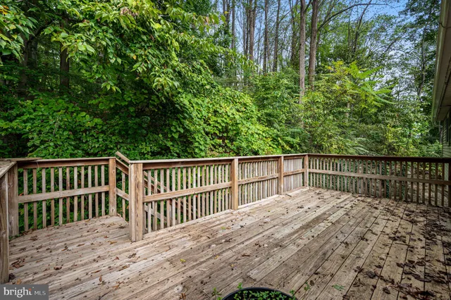 a balcony with trees in front of it