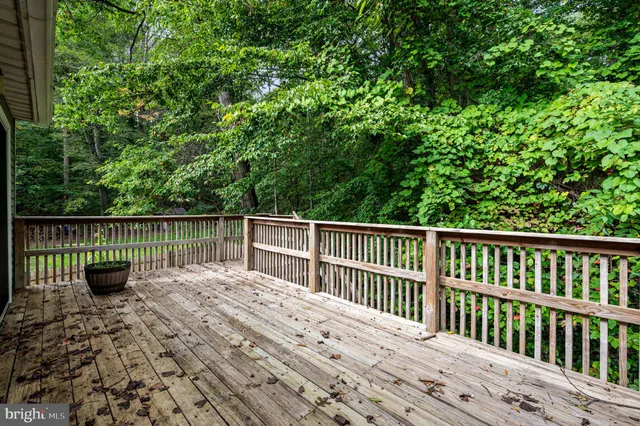 a view of a backyard with chairs