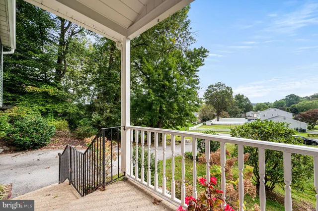 a view of a balcony with wooden floor