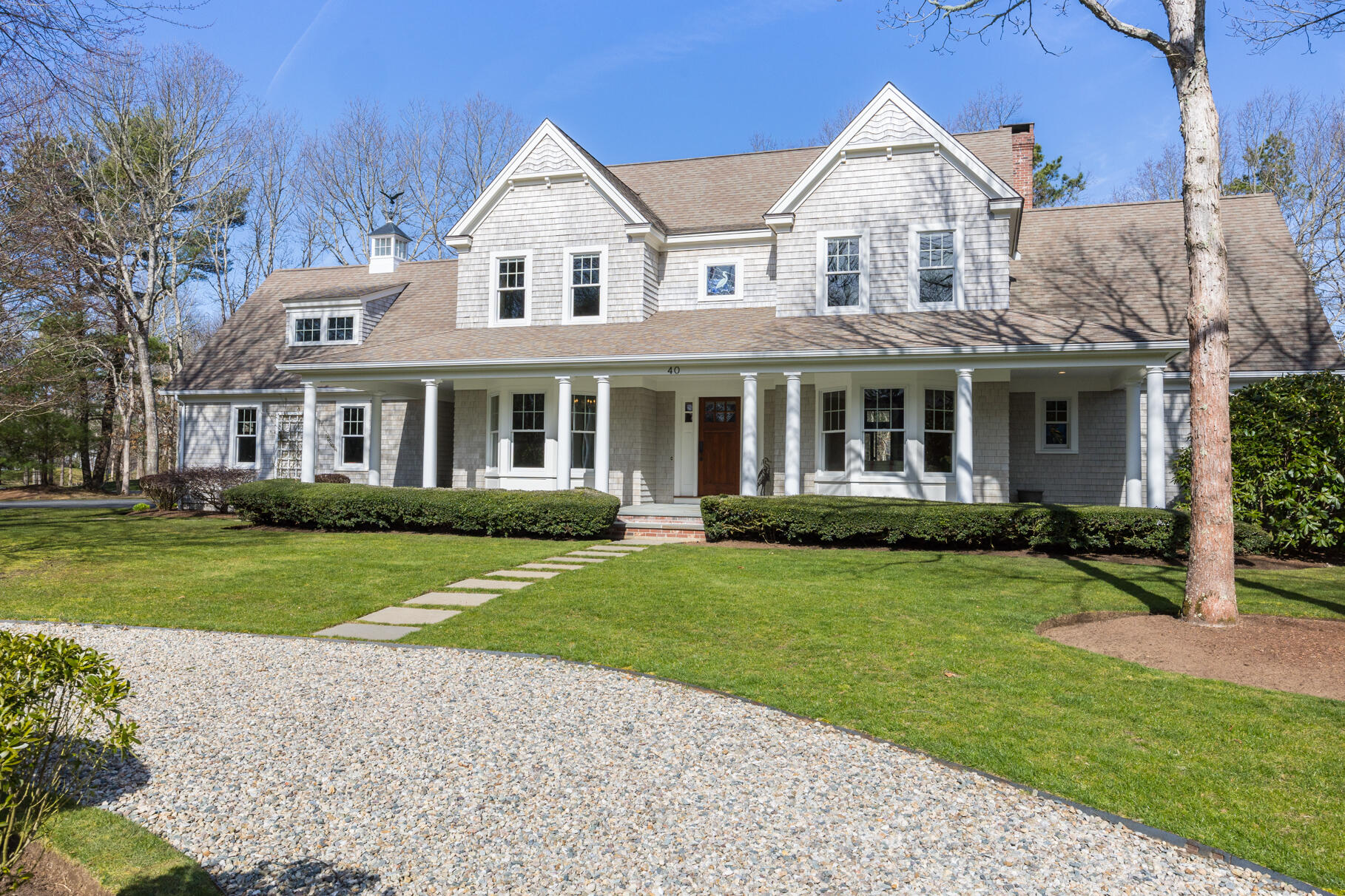 40 Reflection Drive Sandwich, MA 02563 - Photo 1 of 59 a front view of a house with a yard and garage