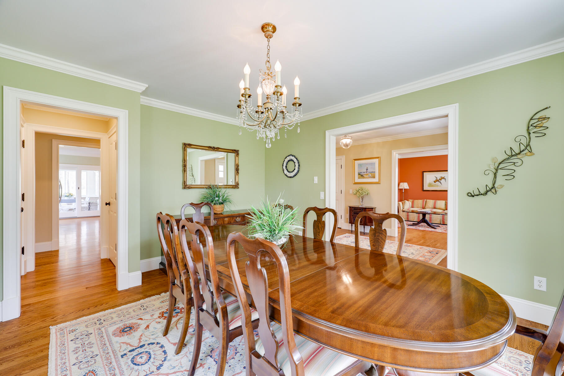 40 Reflection Drive Sandwich, MA 02563 - Photo 18 of 59 a dining room with furniture a chandelier and wooden floor