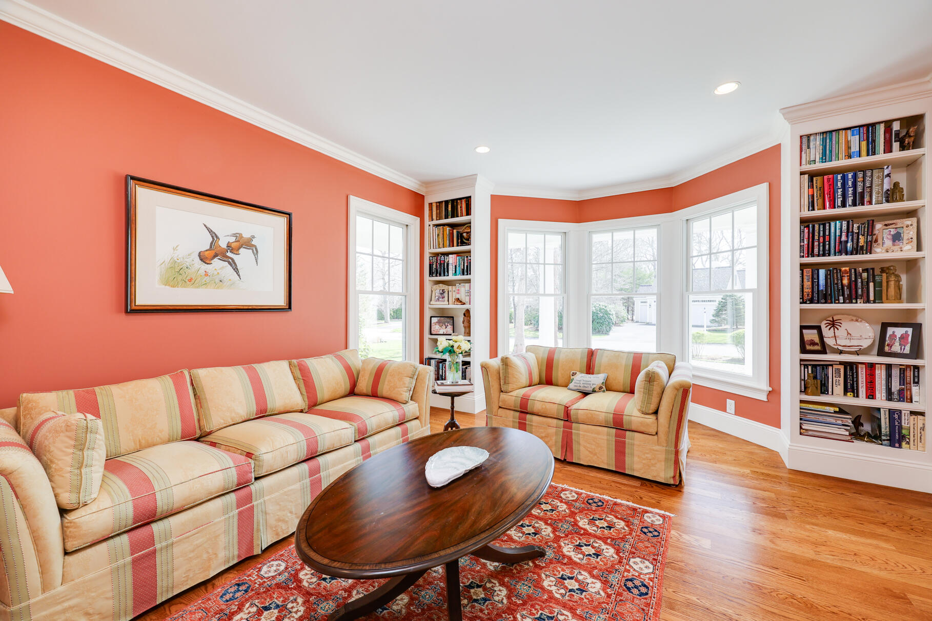 40 Reflection Drive Sandwich, MA 02563 - Photo 19 of 59 a living room with furniture a bookshelf and a large window
