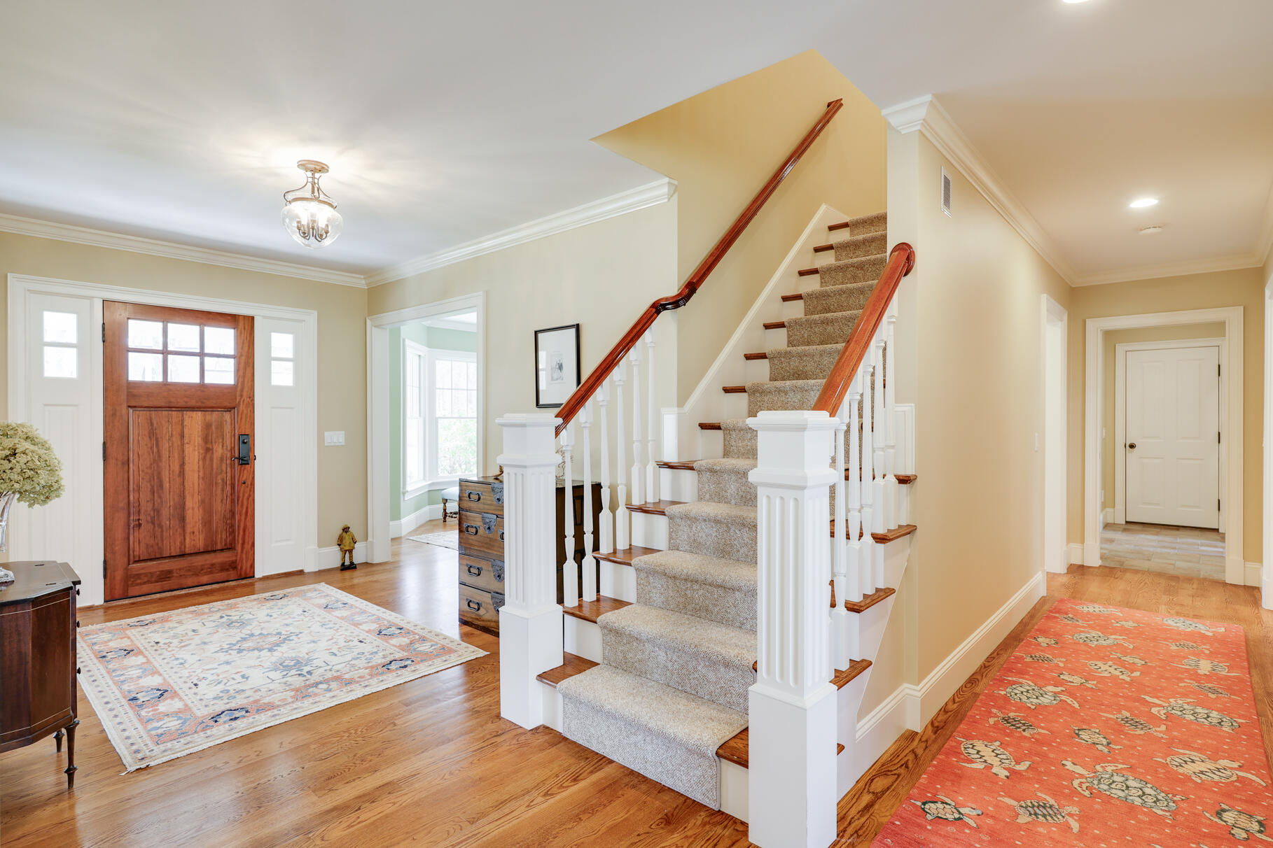 40 Reflection Drive Sandwich, MA 02563 - Photo 27 of 59 a view of front door with hallway and wooden floor