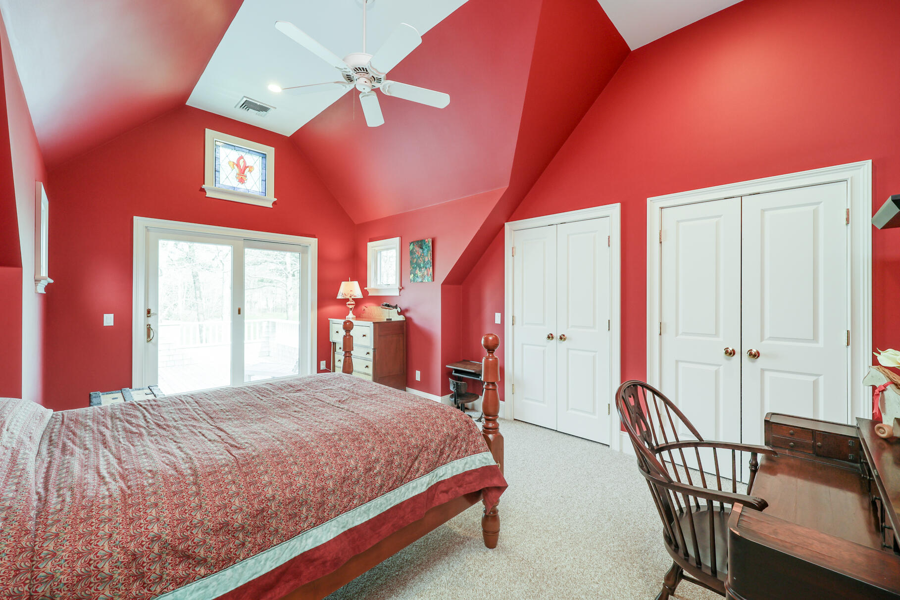 40 Reflection Drive Sandwich, MA 02563 - Photo 31 of 59 a bedroom with a bed a chandelier and dresser