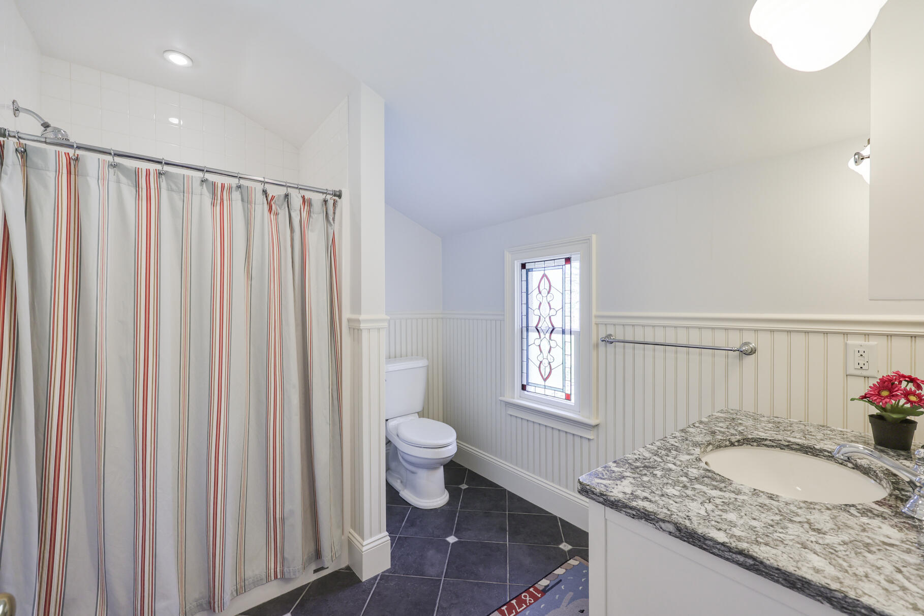 40 Reflection Drive Sandwich, MA 02563 - Photo 34 of 59 a bathroom with a granite countertop sink and a mirror