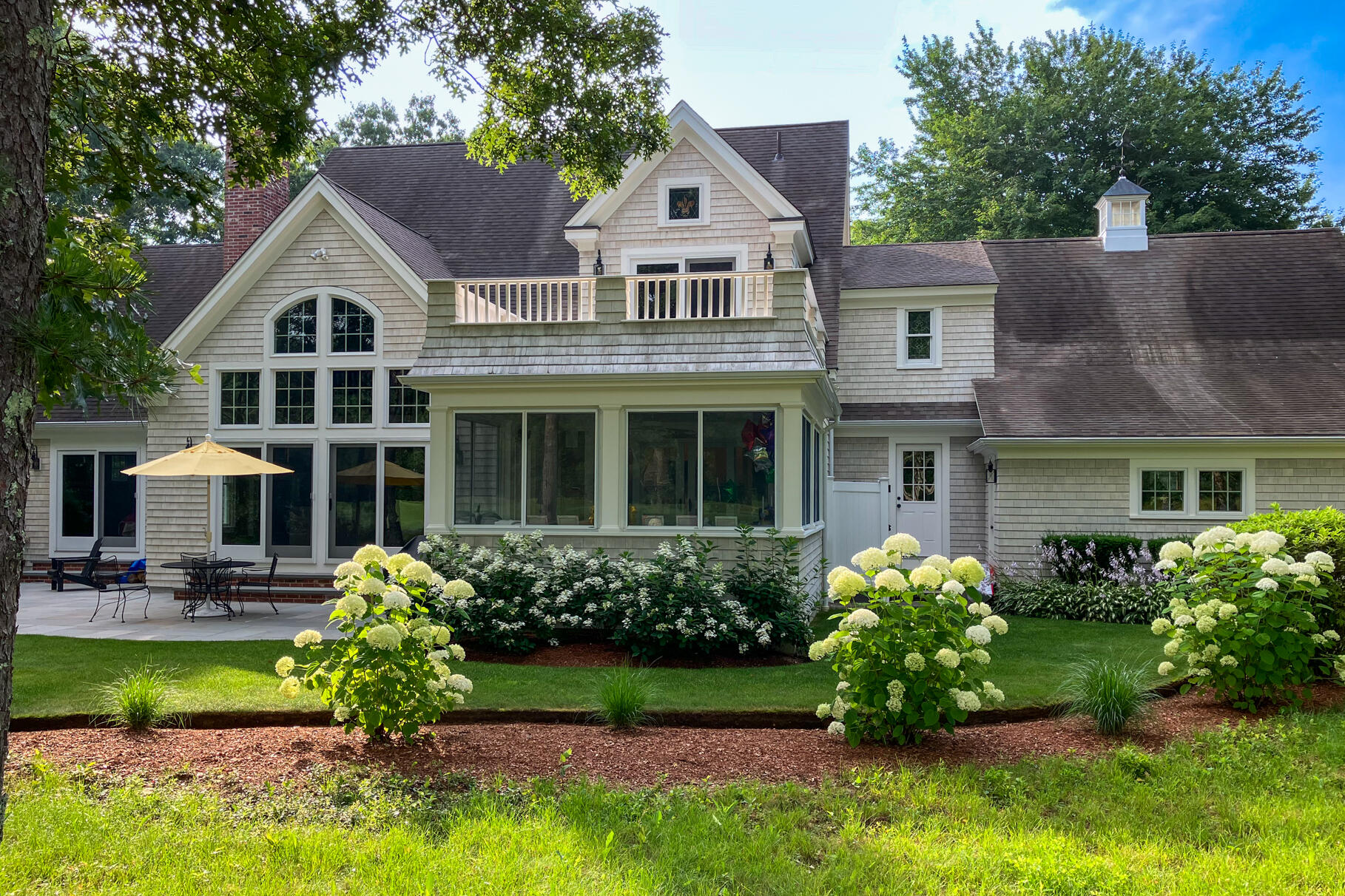 40 Reflection Drive Sandwich, MA 02563 - Photo 41 of 59 a front view of a house with a yard and potted plants