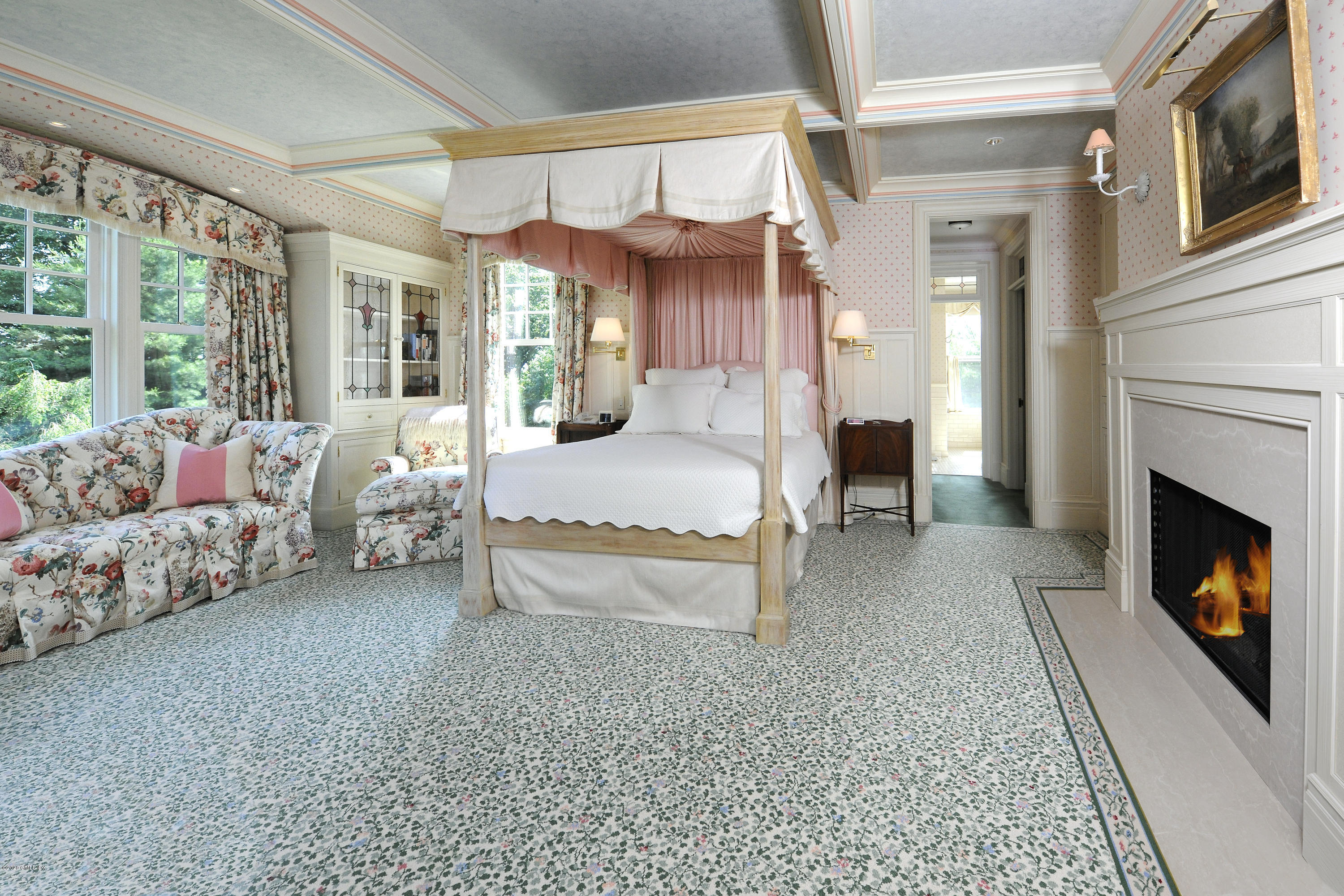 134 Otter Rock Drive Greenwich, CT 06830 - Photo 14 of 25 a bedroom with furniture and a fireplace