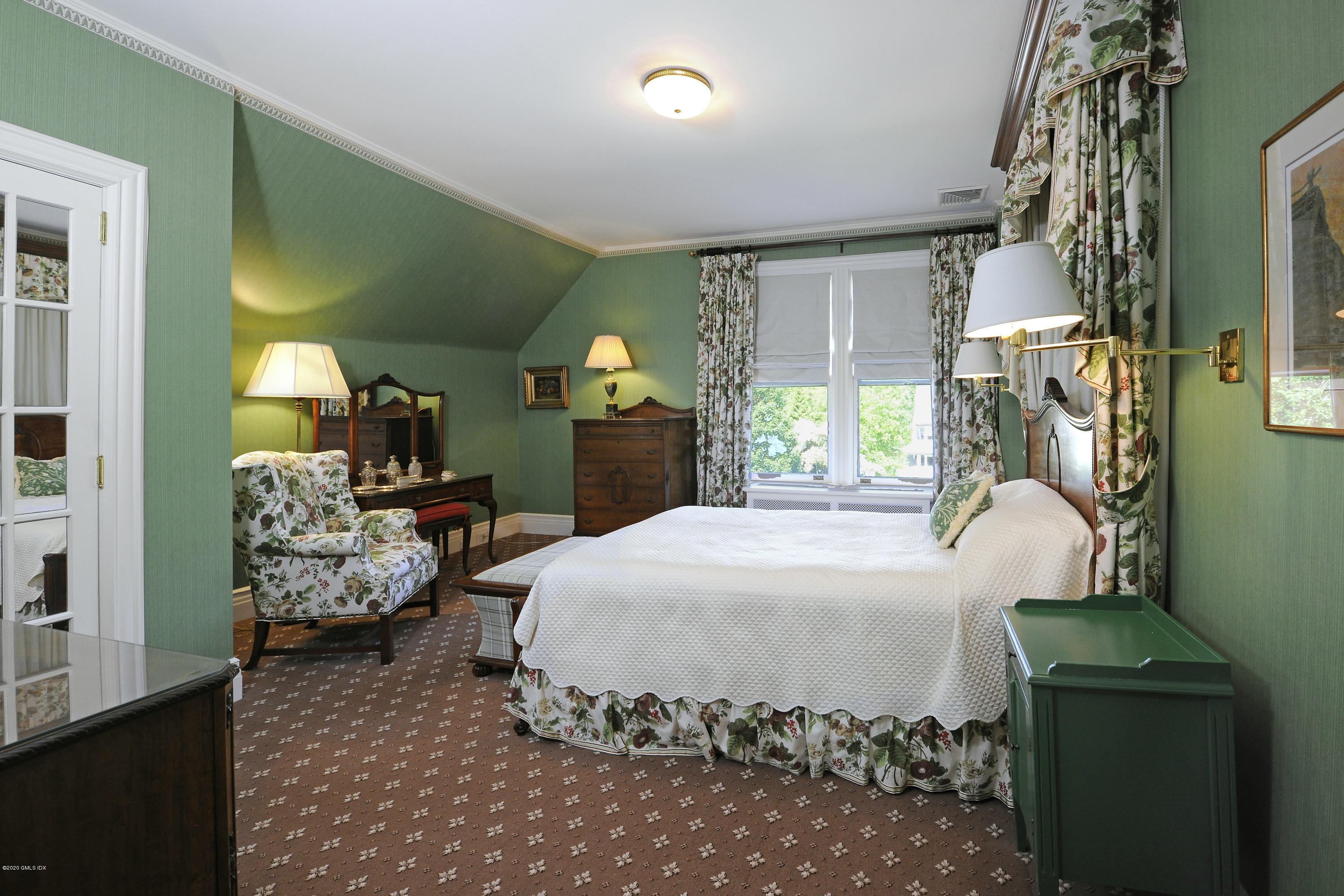 134 Otter Rock Drive Greenwich, CT 06830 - Photo 17 of 25 a bedroom with a bed and large windows