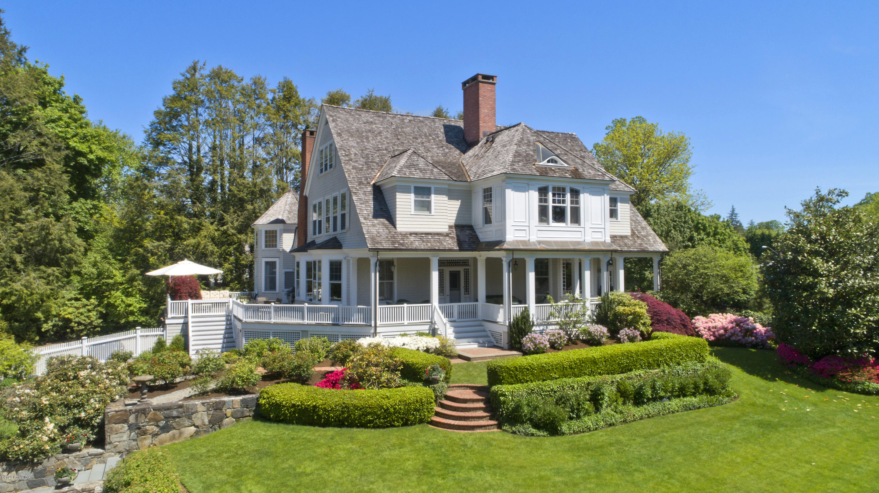 134 Otter Rock Drive Greenwich, CT 06830 - Photo 23 of 25 a front view of a house with garden