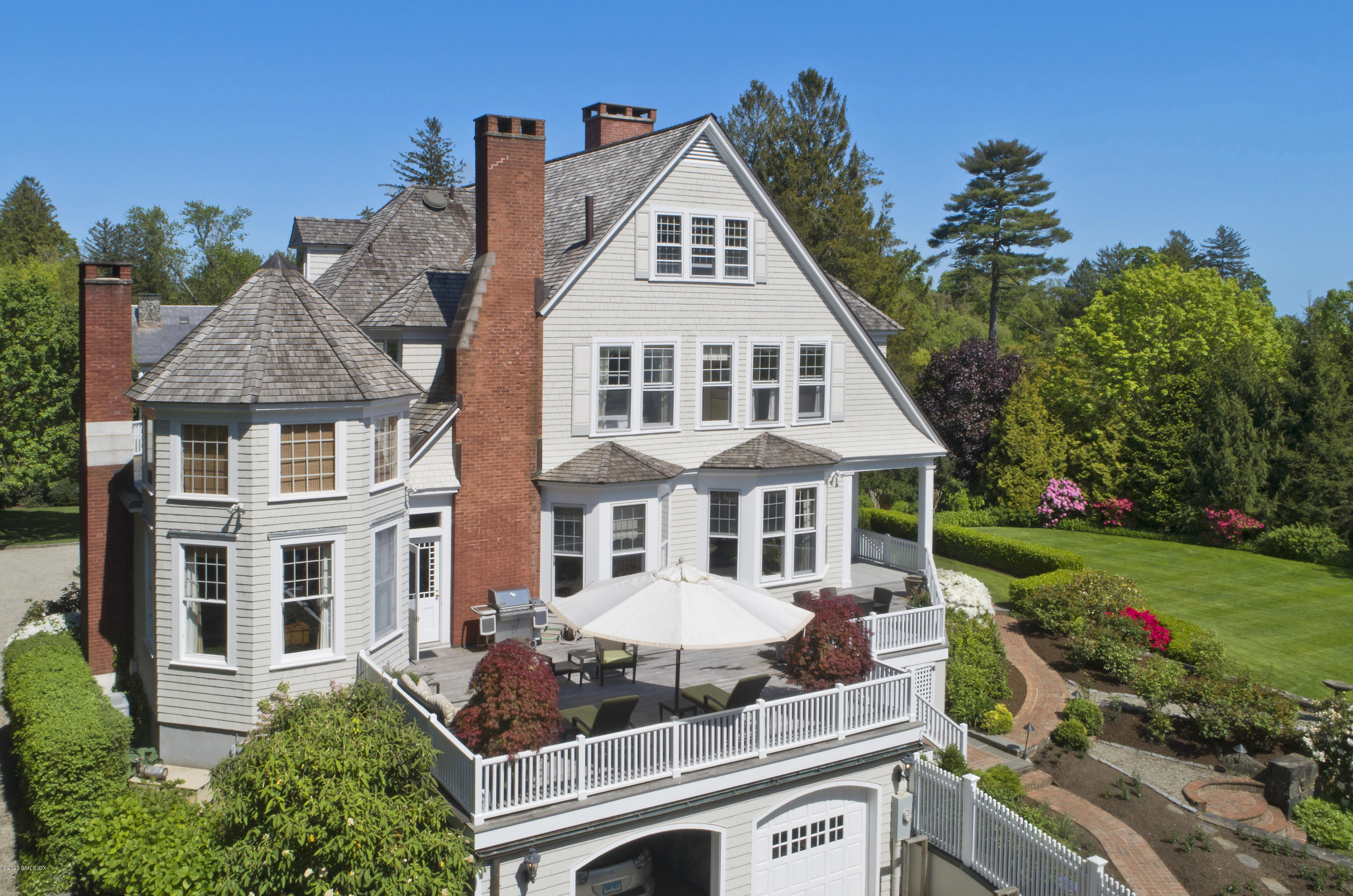 134 Otter Rock Drive Greenwich, CT 06830 - Photo 24 of 25 a front view of a house with garden