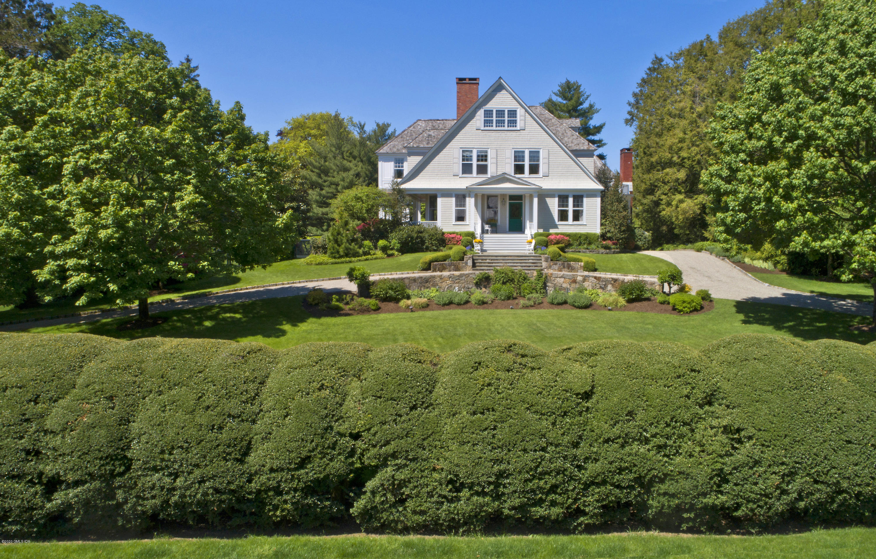 134 Otter Rock Drive Greenwich, CT 06830 - Photo 4 of 25 a front view of a house with a yard