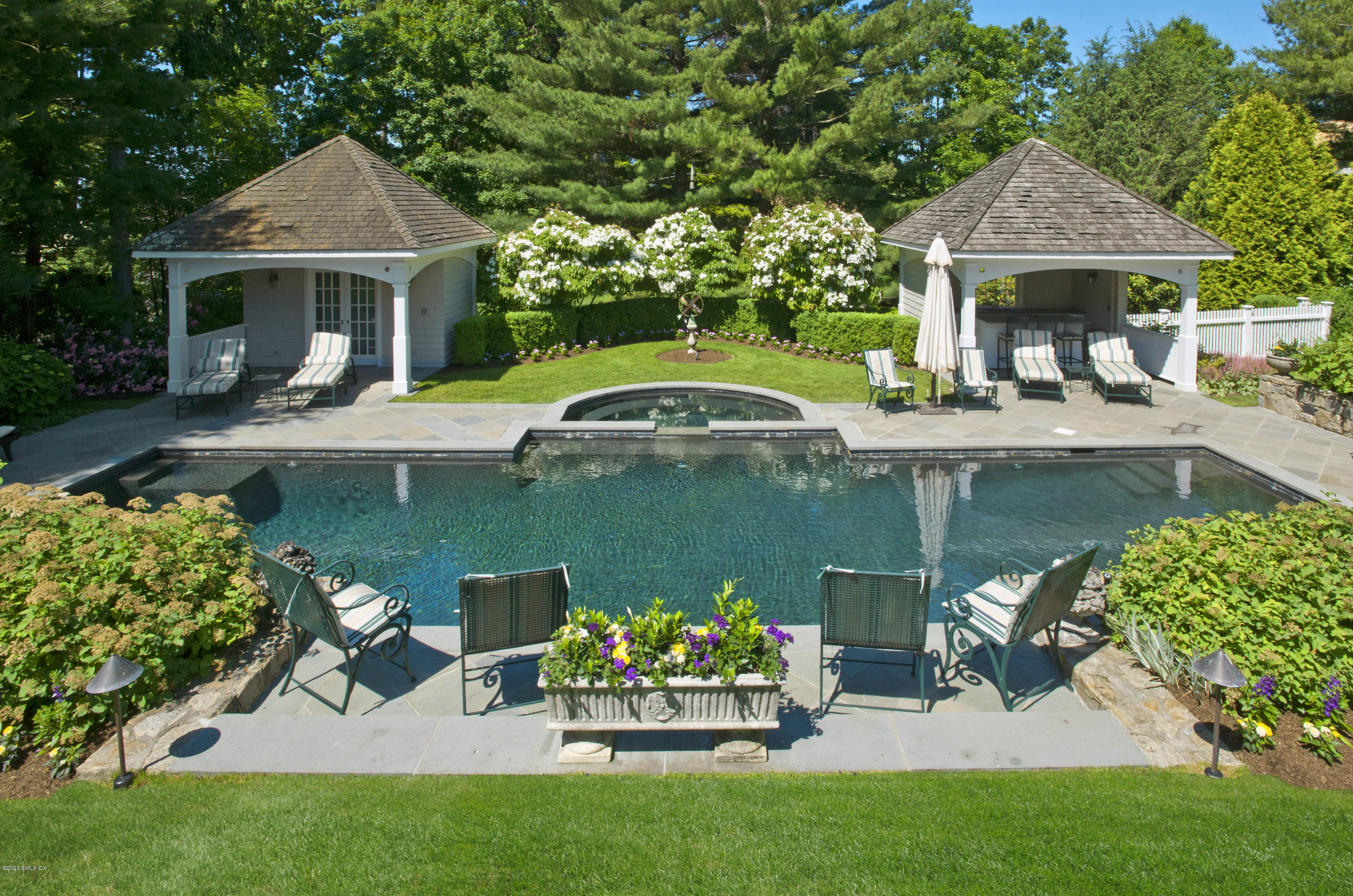 134 Otter Rock Drive Greenwich, CT 06830 - Photo 6 of 25 a front view of a house with garden