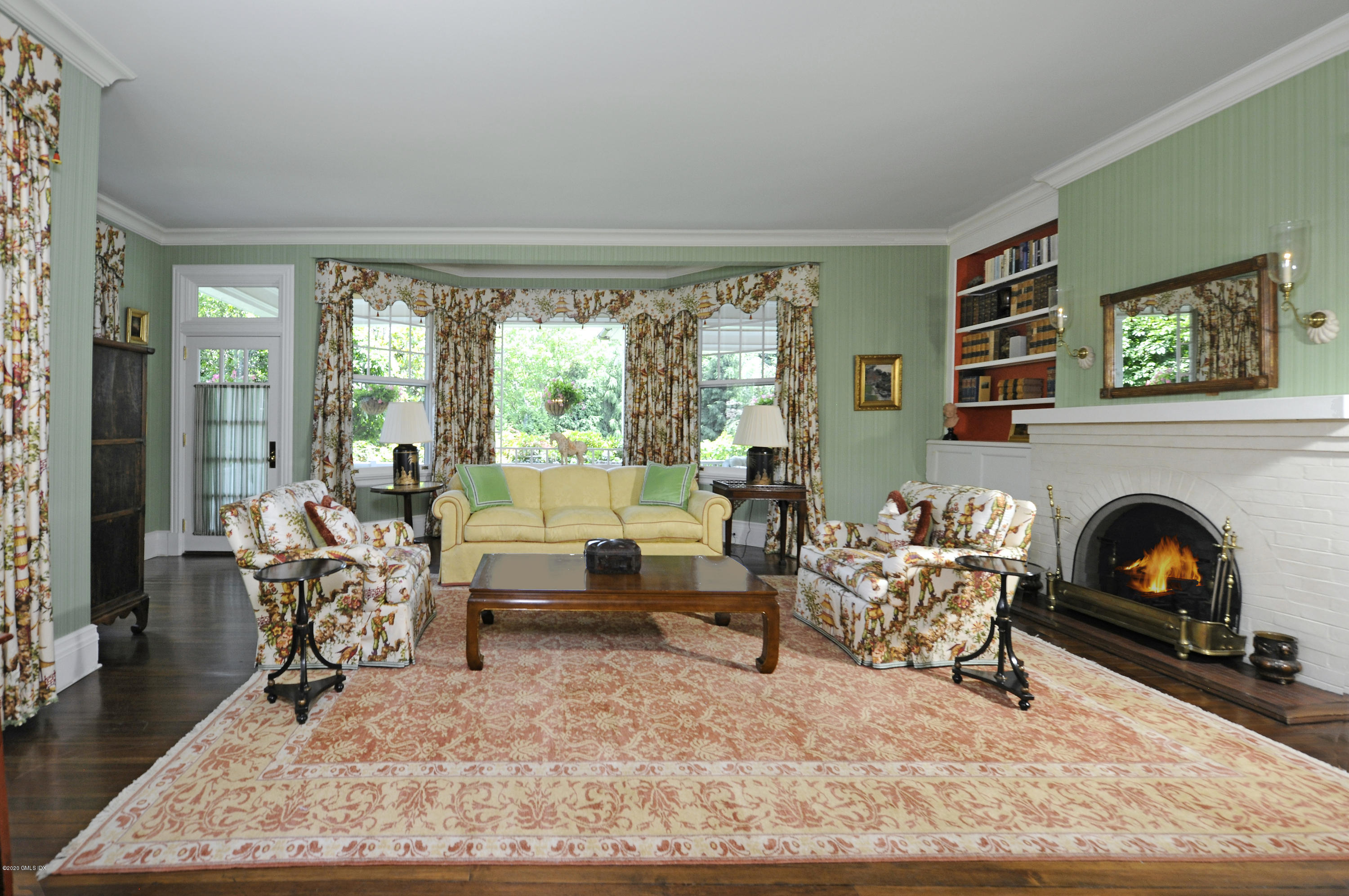 134 Otter Rock Drive Greenwich, CT 06830 - Photo 8 of 25 a living room with furniture and a fireplace