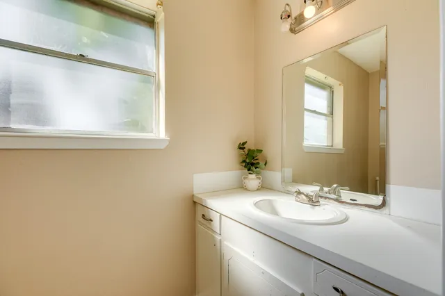 a bathroom with a sink and a mirror