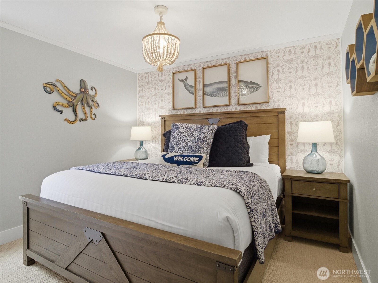 269 Compass Street Pacific Beach, WA 98571 - Photo 25 of 38 a bedroom with a bed and a chandelier