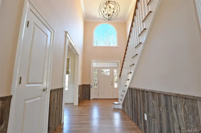 a view of entryway with wooden floor