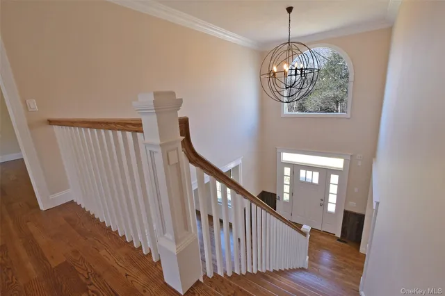 a view of entryway with wooden floor